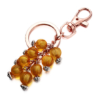 Orange beaded bag charms with rose gold key chain